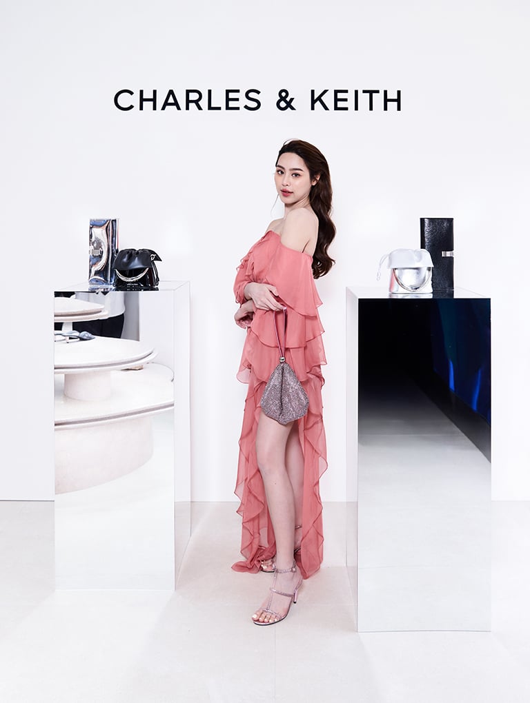 Crystal-Embellished Two-Way Bag in silver and Glittered T-Bar Ankle-Strap Sandals in pink - CHARLES & KEITH