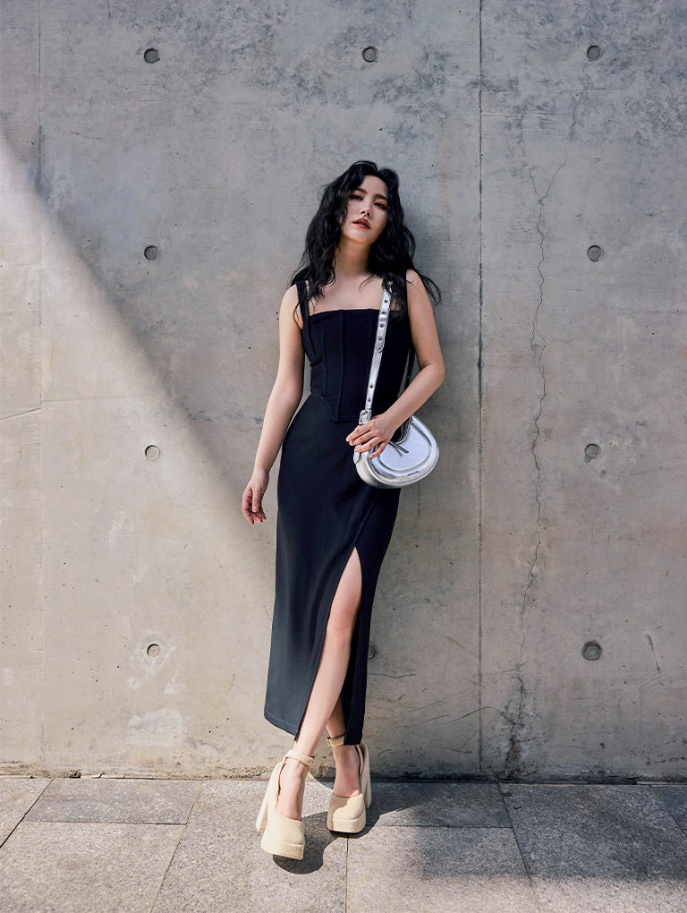 Women’s Petra curved shoulder bag in silver and Loey ankle-strap platform pumps in beige, as seen on Nikki Min – CHARLES & KEITH