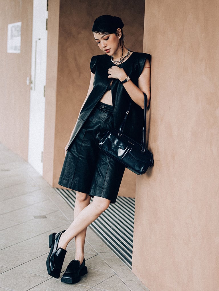 Rachel Elongated Multi-Pocket Shoulder Bag in black and Lorde Geometric Square-Toe Loafers in black - CHARLES & KEITH