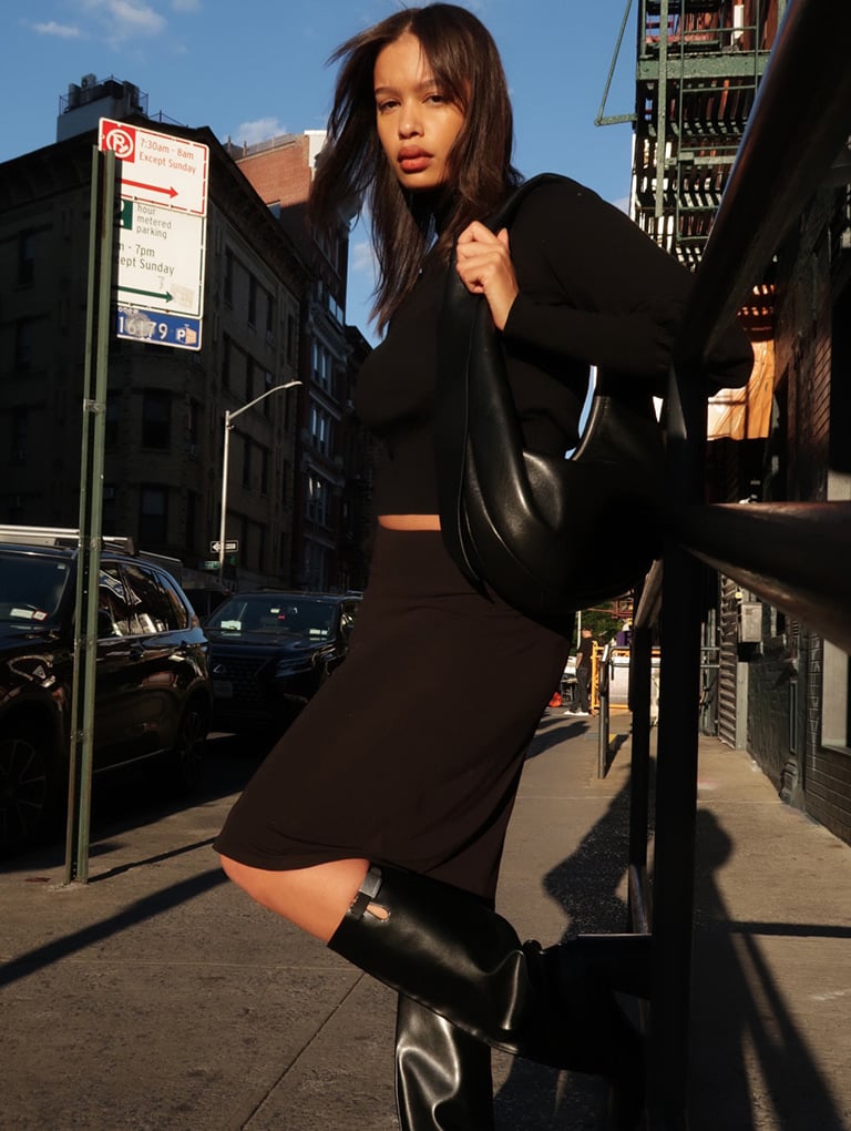 Women’s Toni knotted curved hobo bag in noir & Robbie platform knee-high boots in black, as seen on Shimma Marie - CHARLES & KEITH